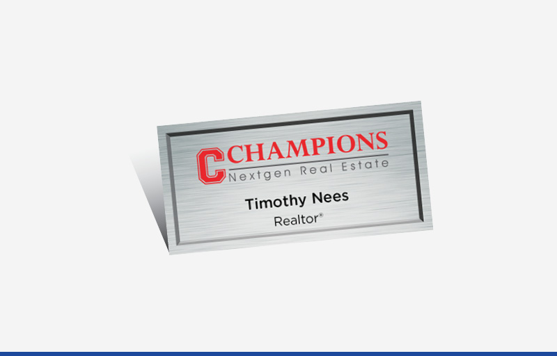 Champions Nextgen Real Estate Full Color Silver Metallic Name Badge | BestPrintBuy.com